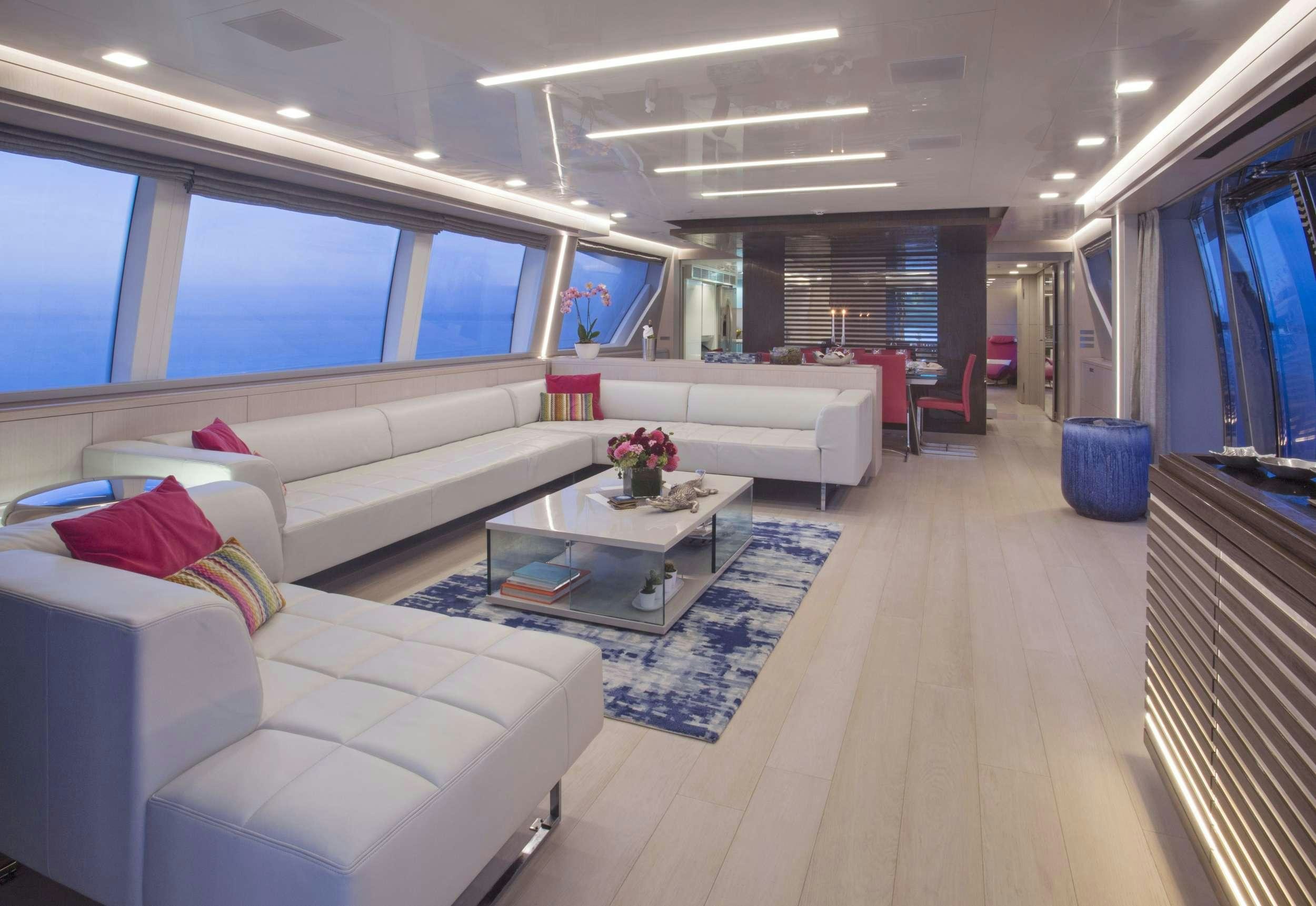 a living room with a couch and a coffee table aboard ALANDREA Yacht for Charter