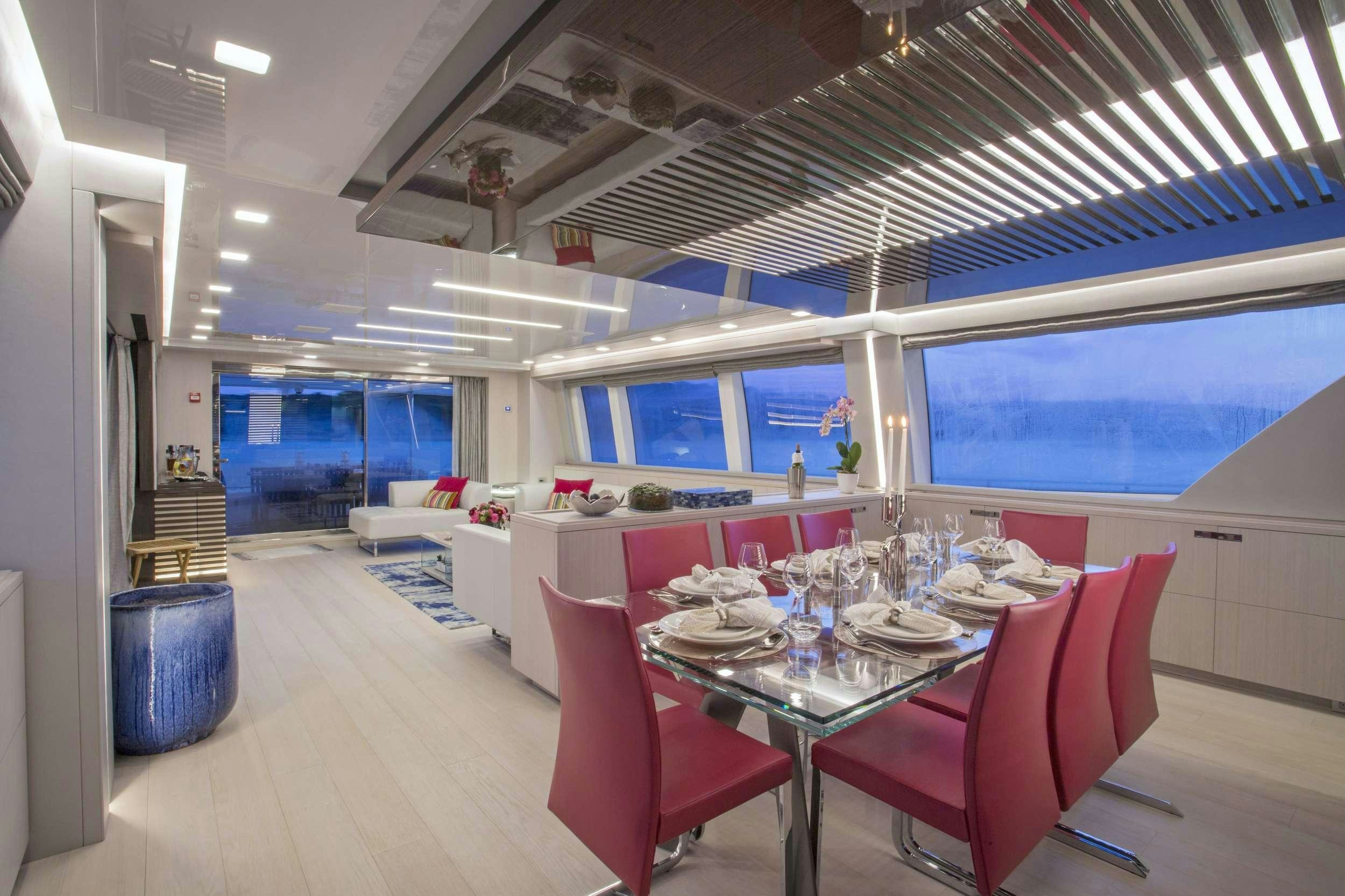 a dining room with a table and chairs aboard ALANDREA Yacht for Charter