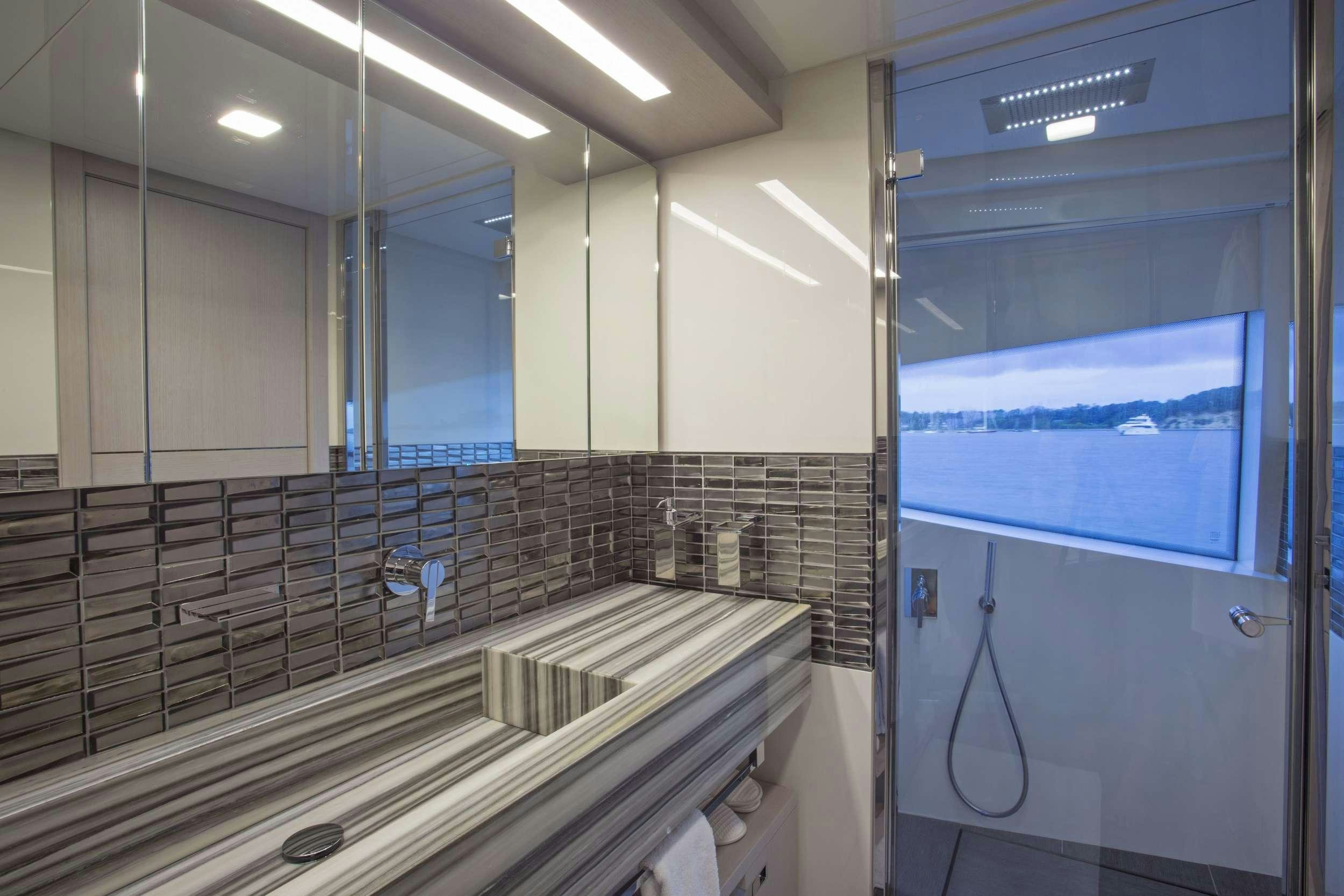 a bathroom with a large mirror aboard ALANDREA Yacht for Charter