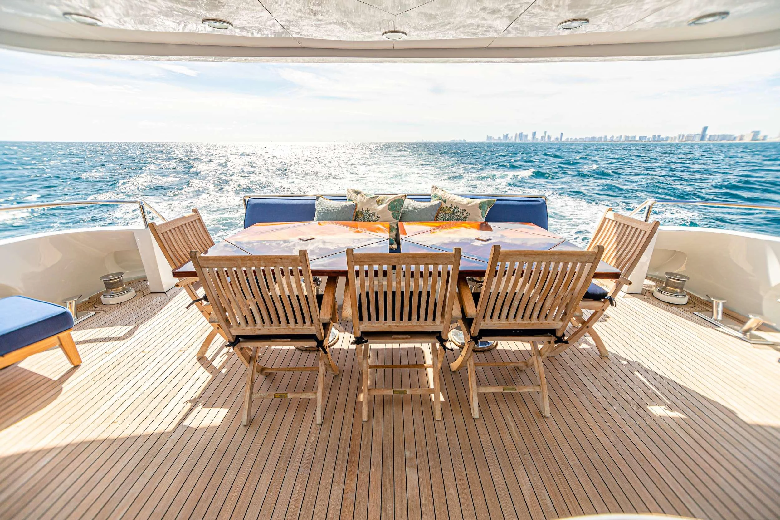 a group of chairs on a deck by a pool aboard XOXO (118') Yacht for Charter