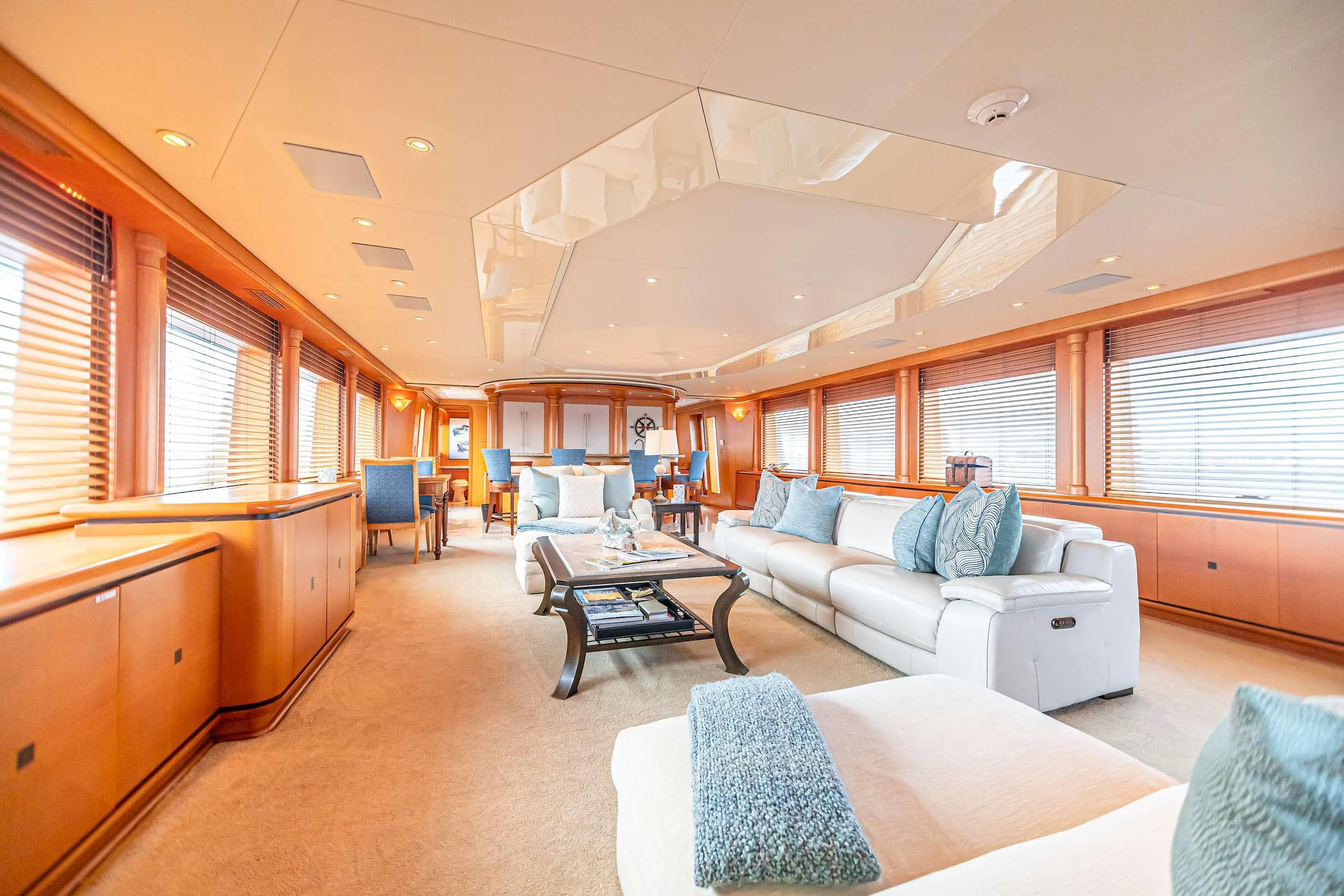 a large living room with a large window aboard XOXO (118') Yacht for Charter