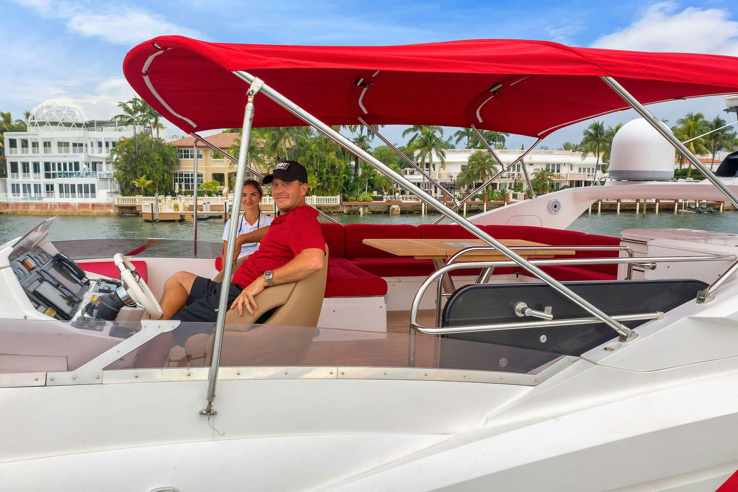 a man and woman on a boat aboard GEM Yacht for Charter