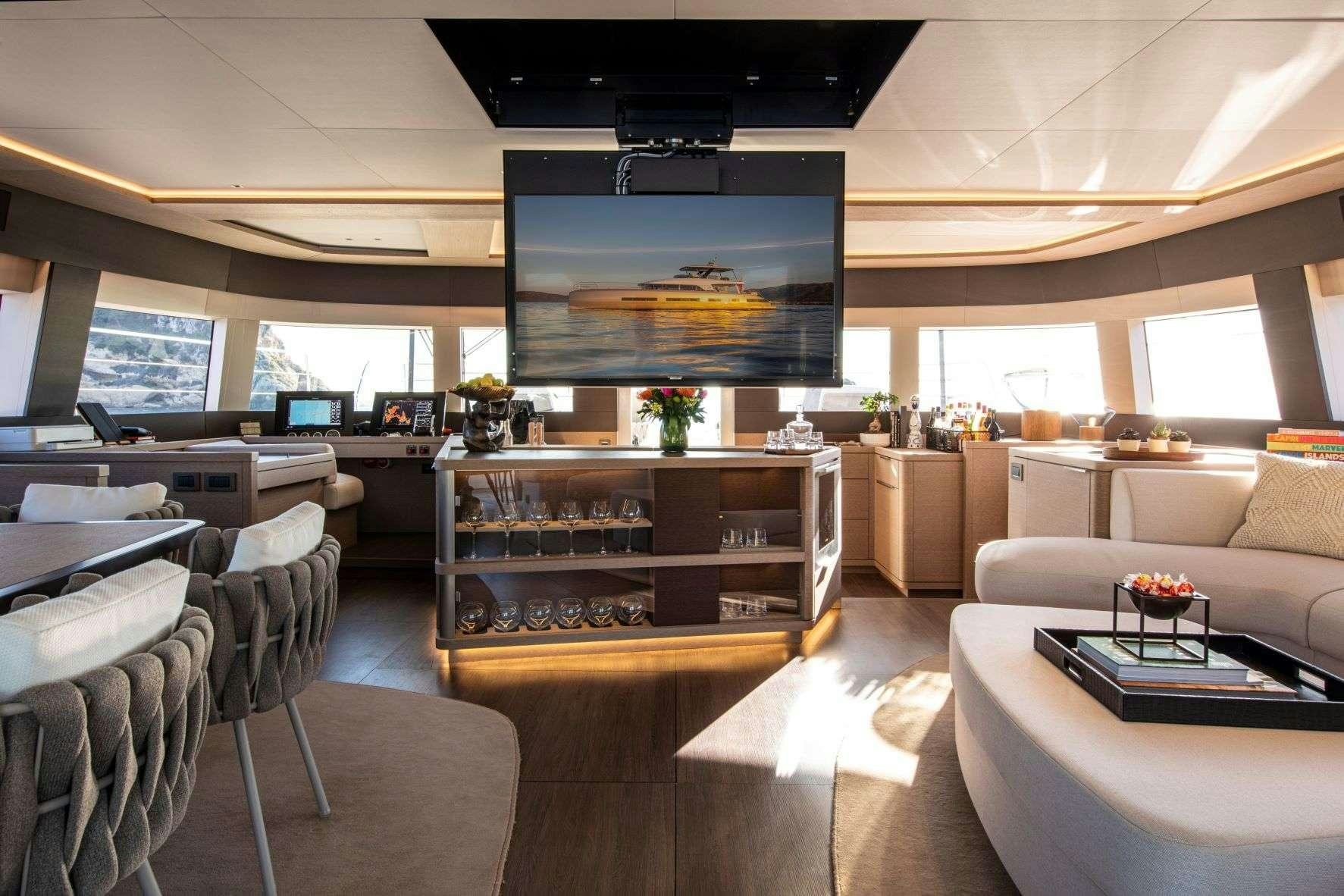 a room with a large screen aboard SASTA Yacht for Charter
