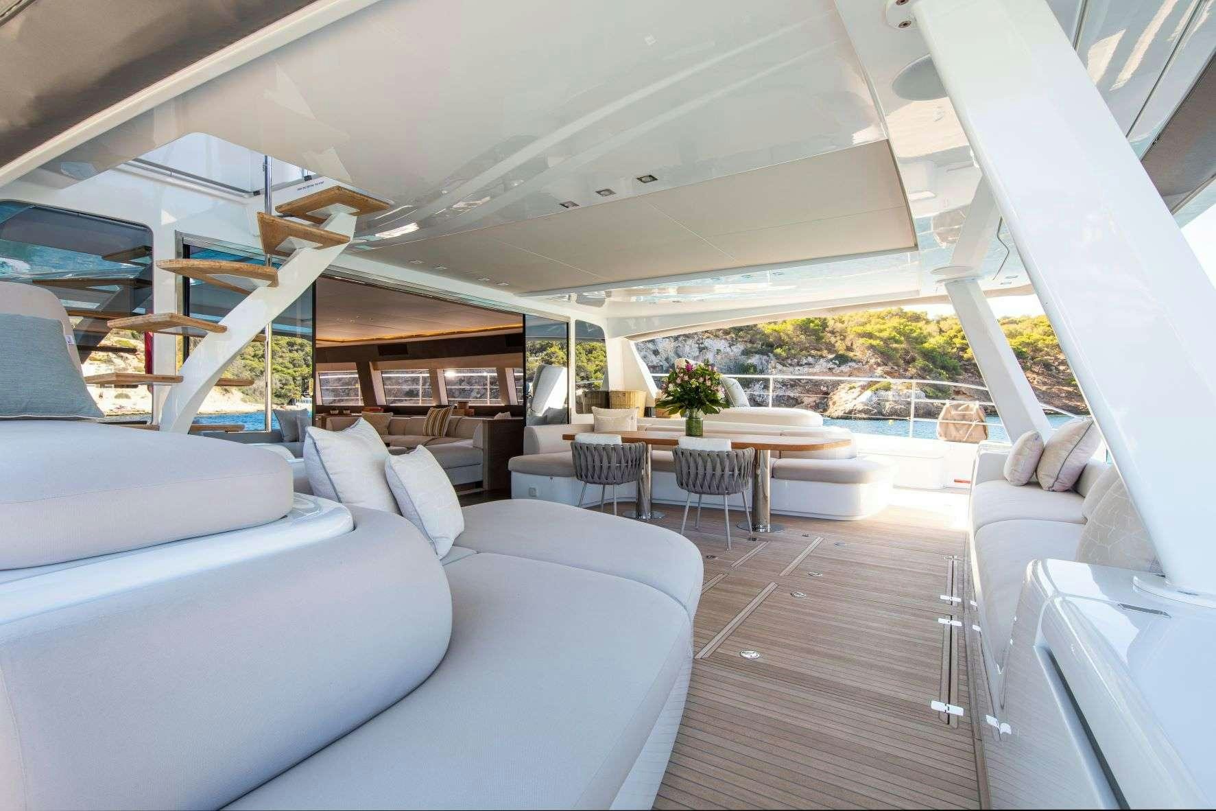 a room with a couch and a table aboard SASTA Yacht for Charter
