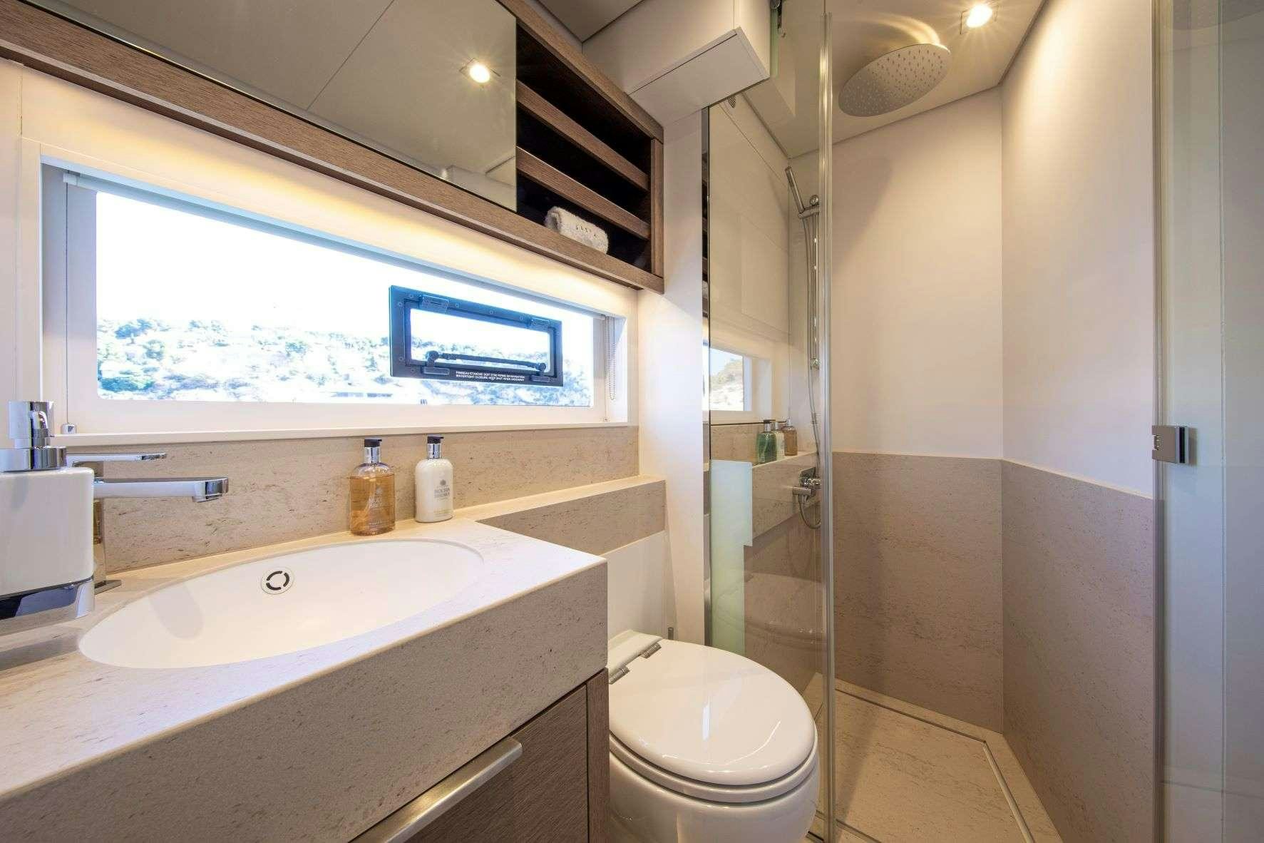 a bathroom with a sink and toilet aboard SASTA Yacht for Charter