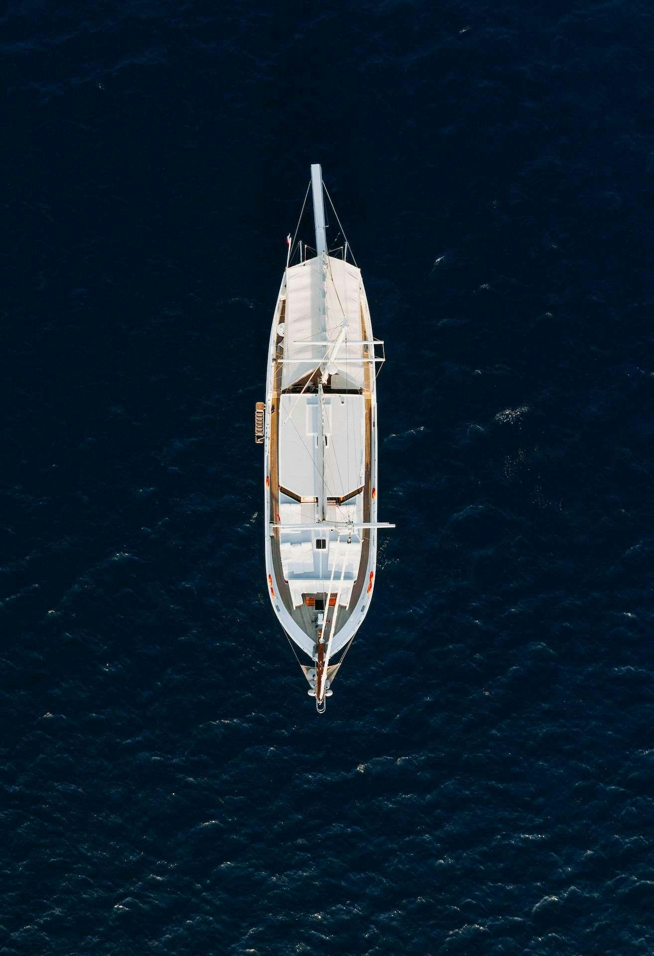 a white ship in the water aboard BEYAZ LALE Yacht for Charter