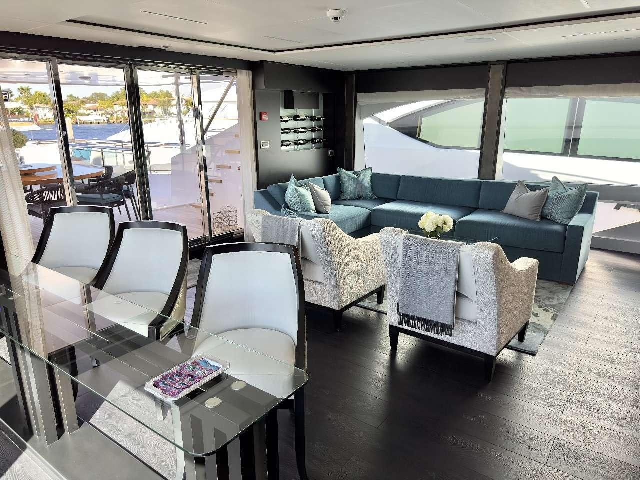 a living room with a couch and a table aboard ROMEO FOXTROT Yacht for Charter