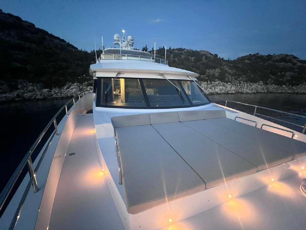 a boat on a river aboard ROMEO FOXTROT Yacht for Charter