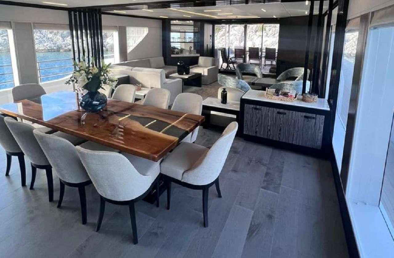 a room with a table and chairs aboard ROMEO FOXTROT Yacht for Charter