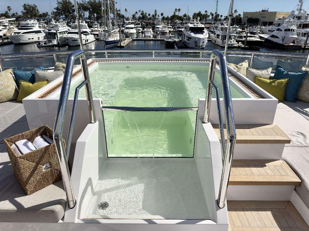 a boat dock with boats aboard ROMEO FOXTROT Yacht for Charter