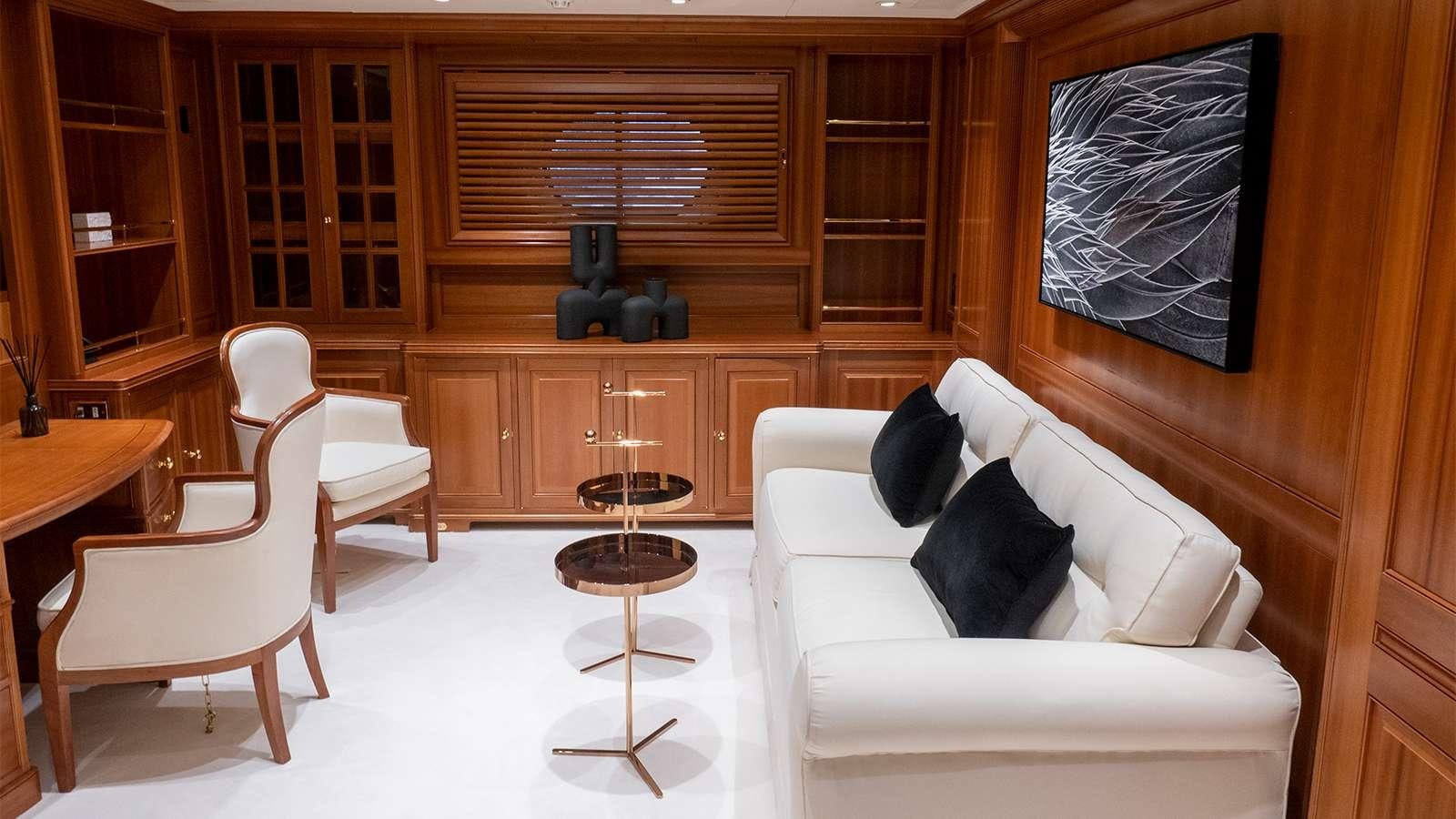 a room with a couch and chairs aboard ALMYRA II Yacht for Charter