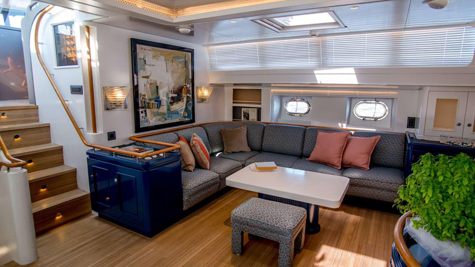 a living room with a couch and a table aboard AFAET Yacht for Charter