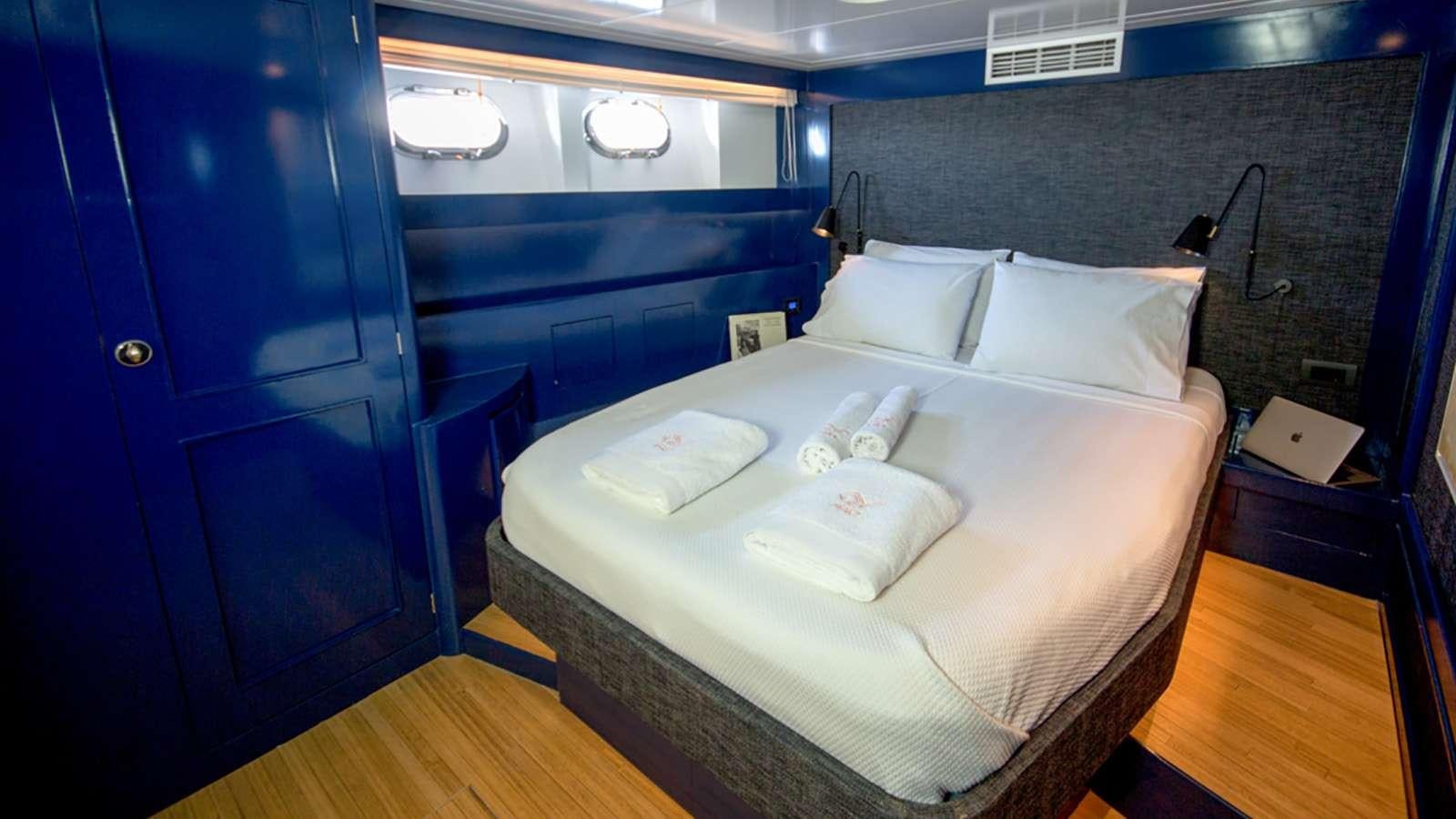 a bed in a room aboard AFAET Yacht for Charter