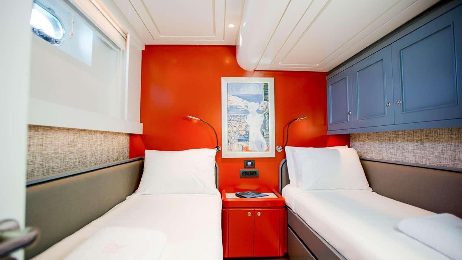a room with two beds aboard AFAET Yacht for Charter