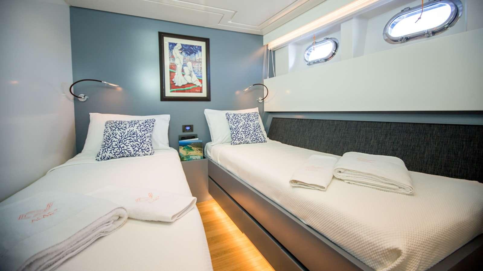 a room with two beds aboard AFAET Yacht for Charter
