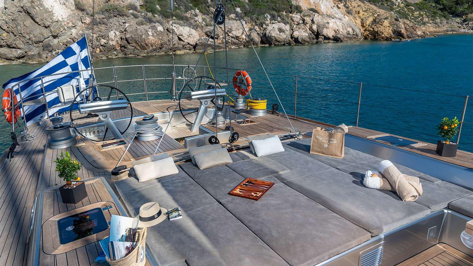 a deck with a deck and chairs aboard BLACK LION Yacht for Charter