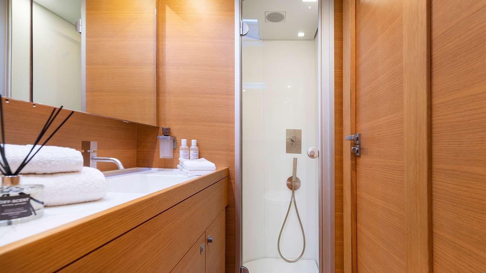 a bathroom with a sink and a mirror aboard BLACK LION Yacht for Charter