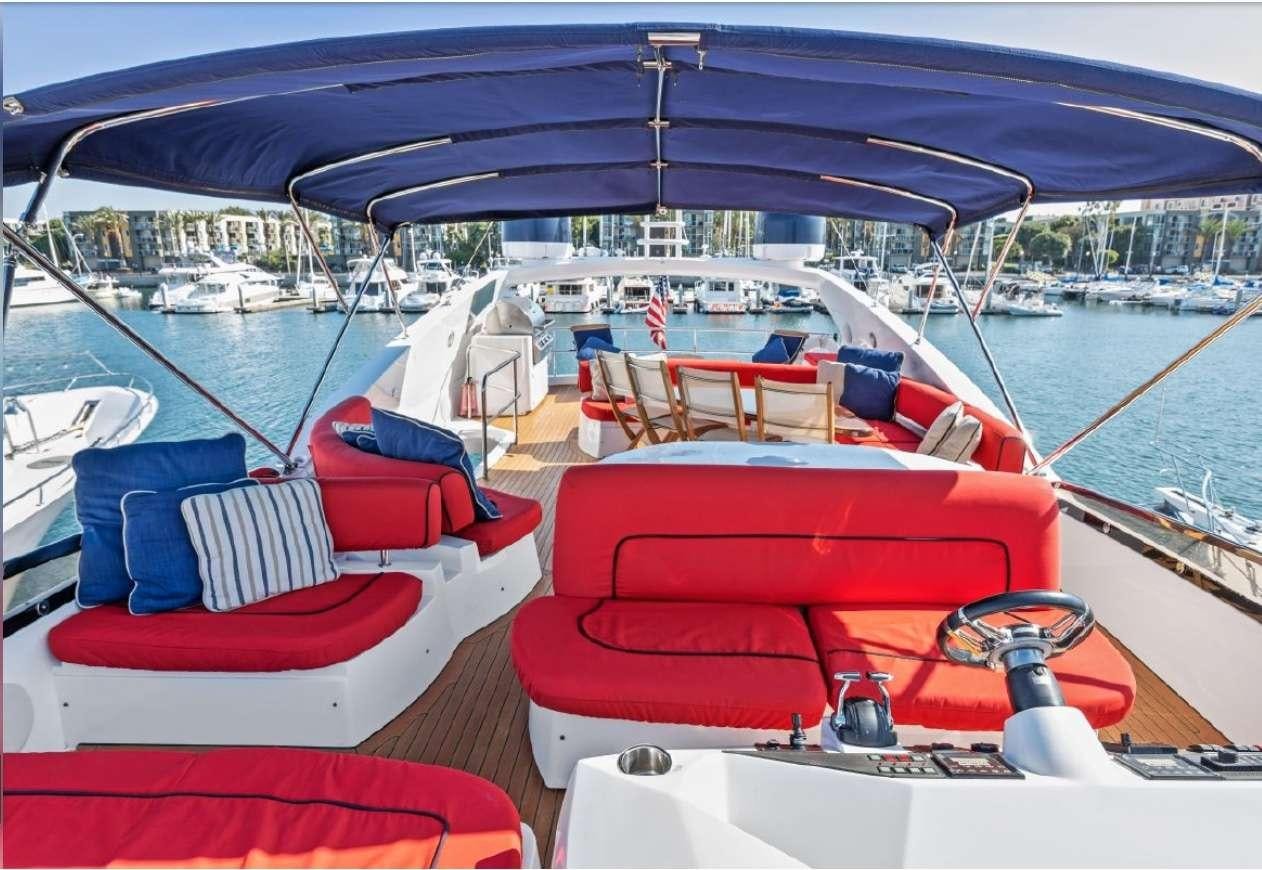 a boat with red seats aboard QUANTUM Yacht for Charter