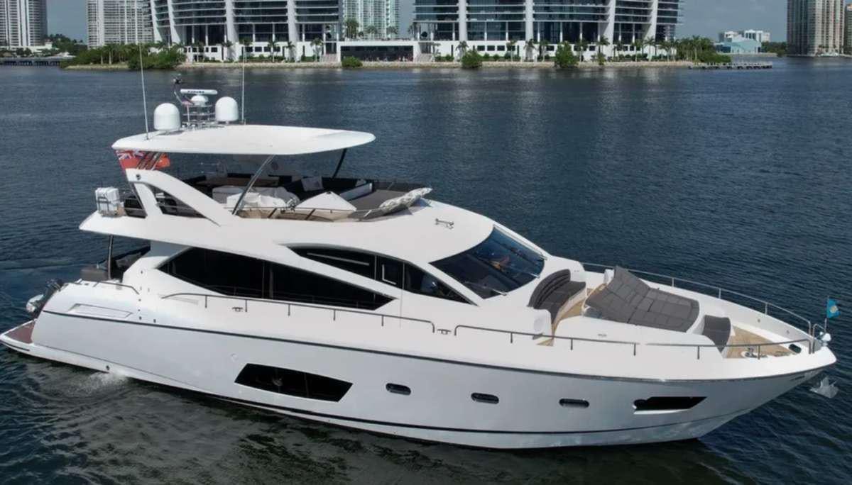 a white yacht on a beach aboard IT'S ENOUGH Yacht for Charter