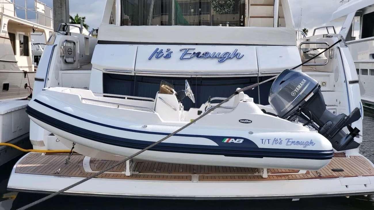 a boat parked in a harbor aboard IT'S ENOUGH Yacht for Charter