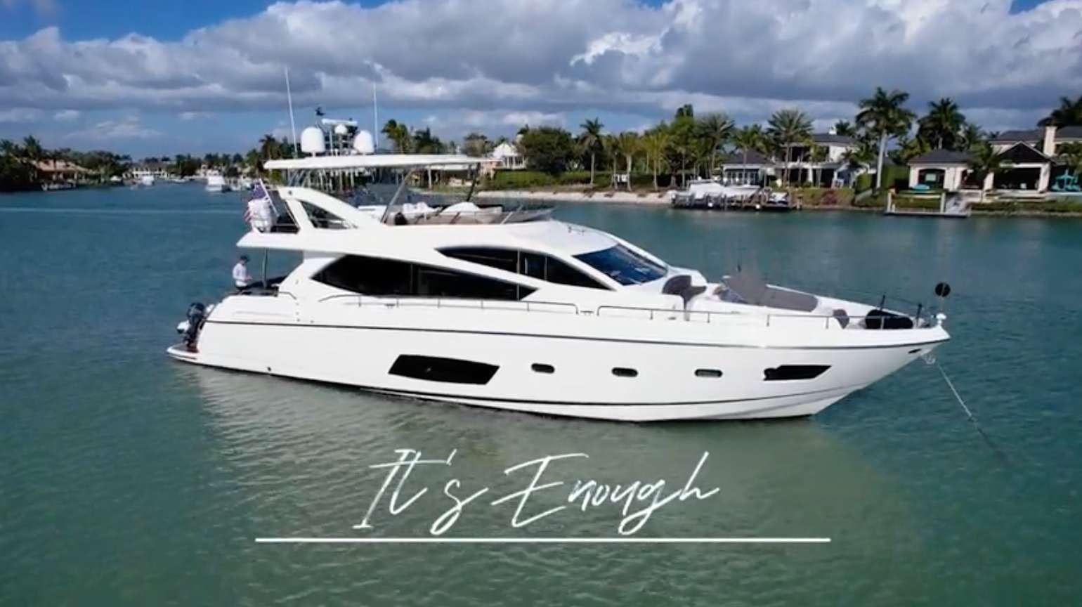 a white boat in the water aboard IT'S ENOUGH Yacht for Charter