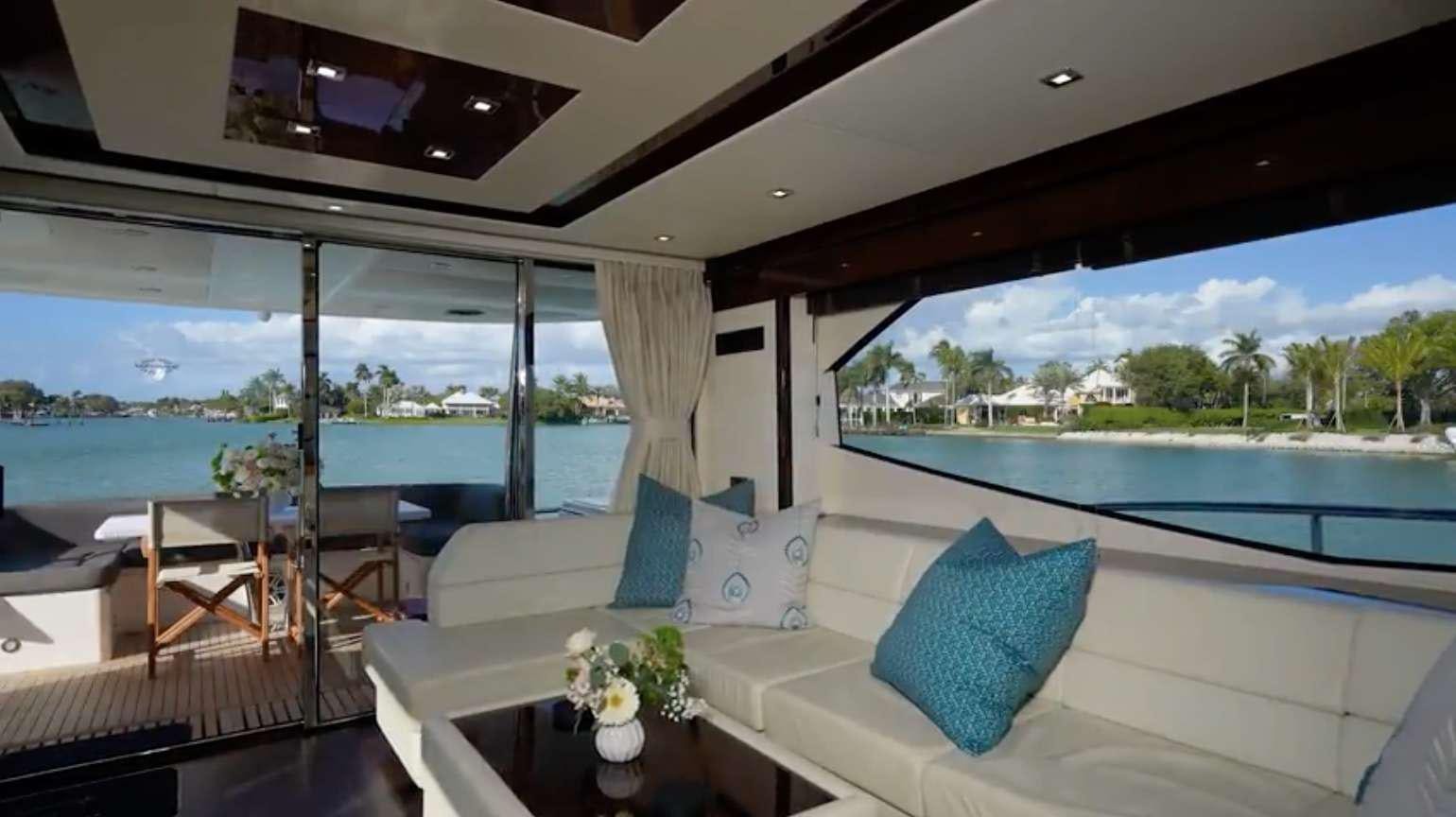a room with a couch and a pool aboard IT'S ENOUGH Yacht for Charter