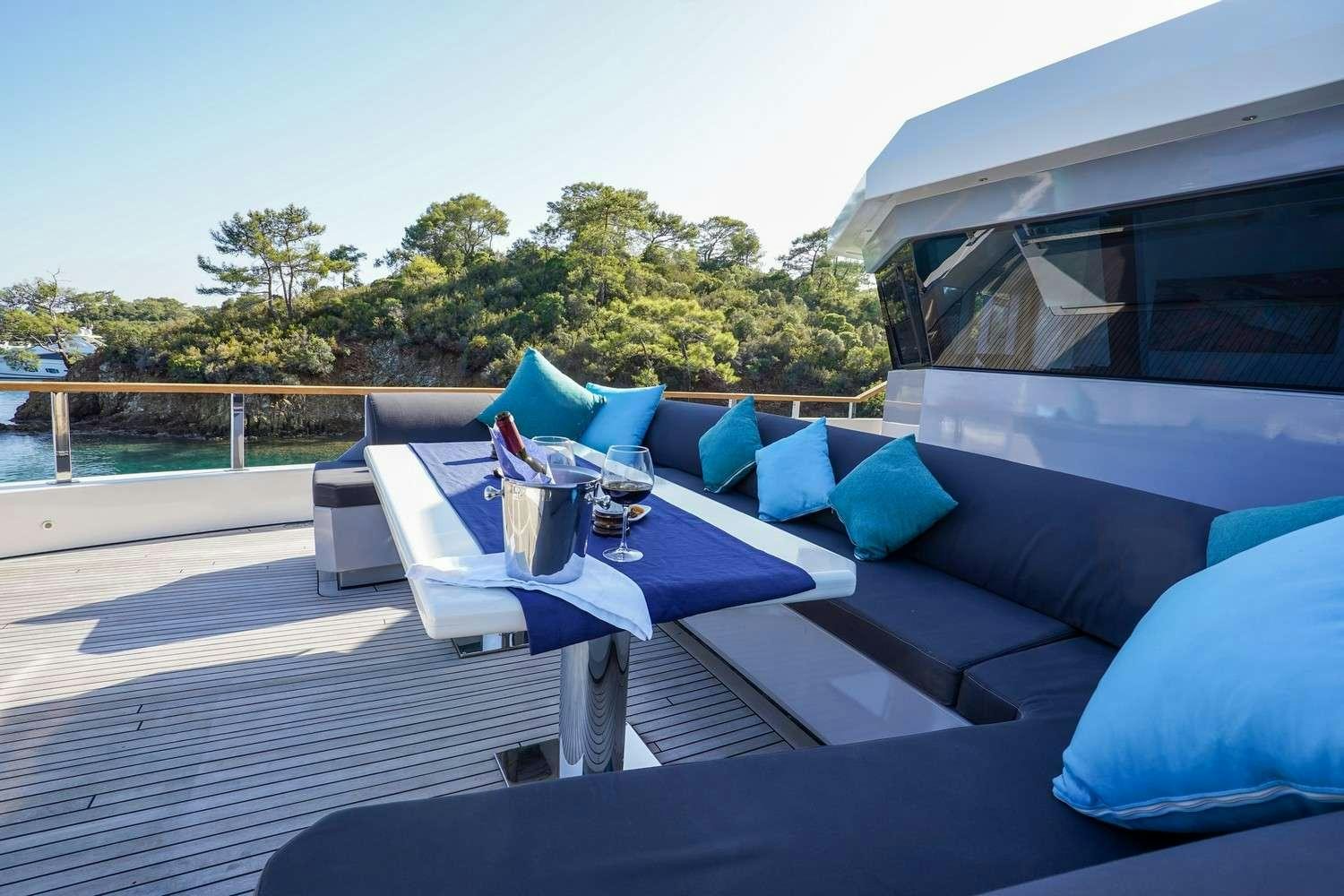 a patio with a table and chairs aboard CINAR YILDIZI Yacht for Charter
