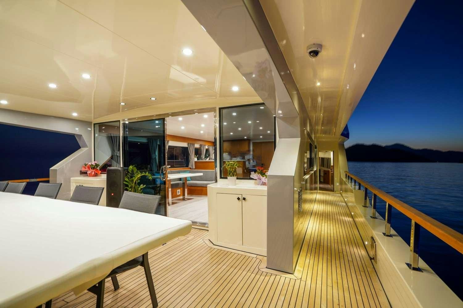a room with tables and chairs aboard CINAR YILDIZI Yacht for Charter