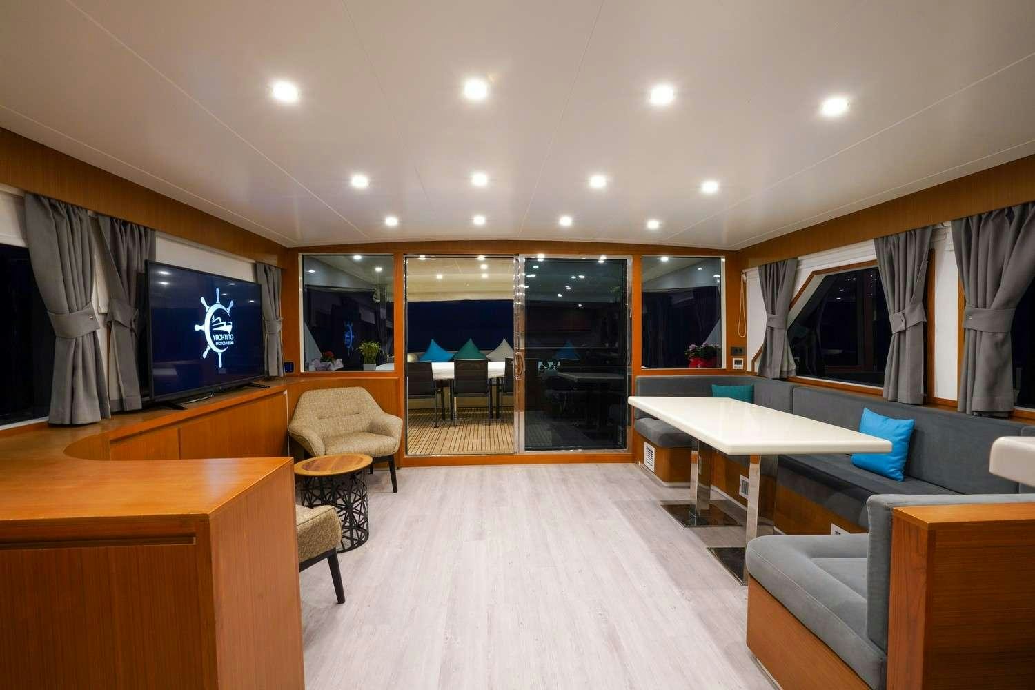 a room with a table and chairs aboard CINAR YILDIZI Yacht for Charter