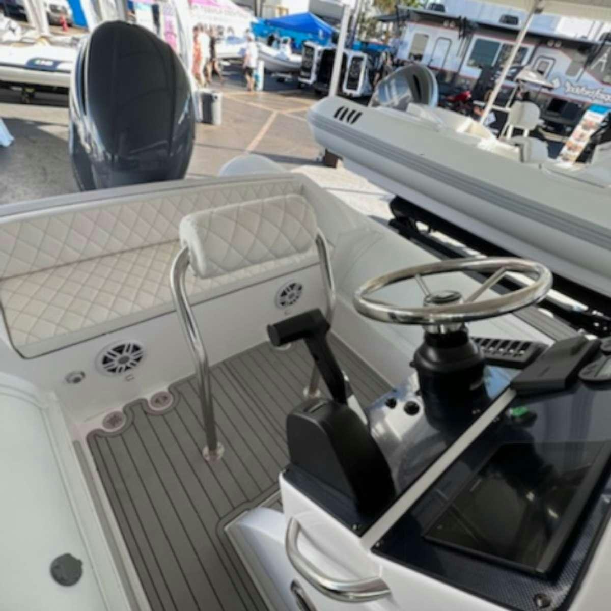 a white car with a seat aboard LINDY LOU Yacht for Charter