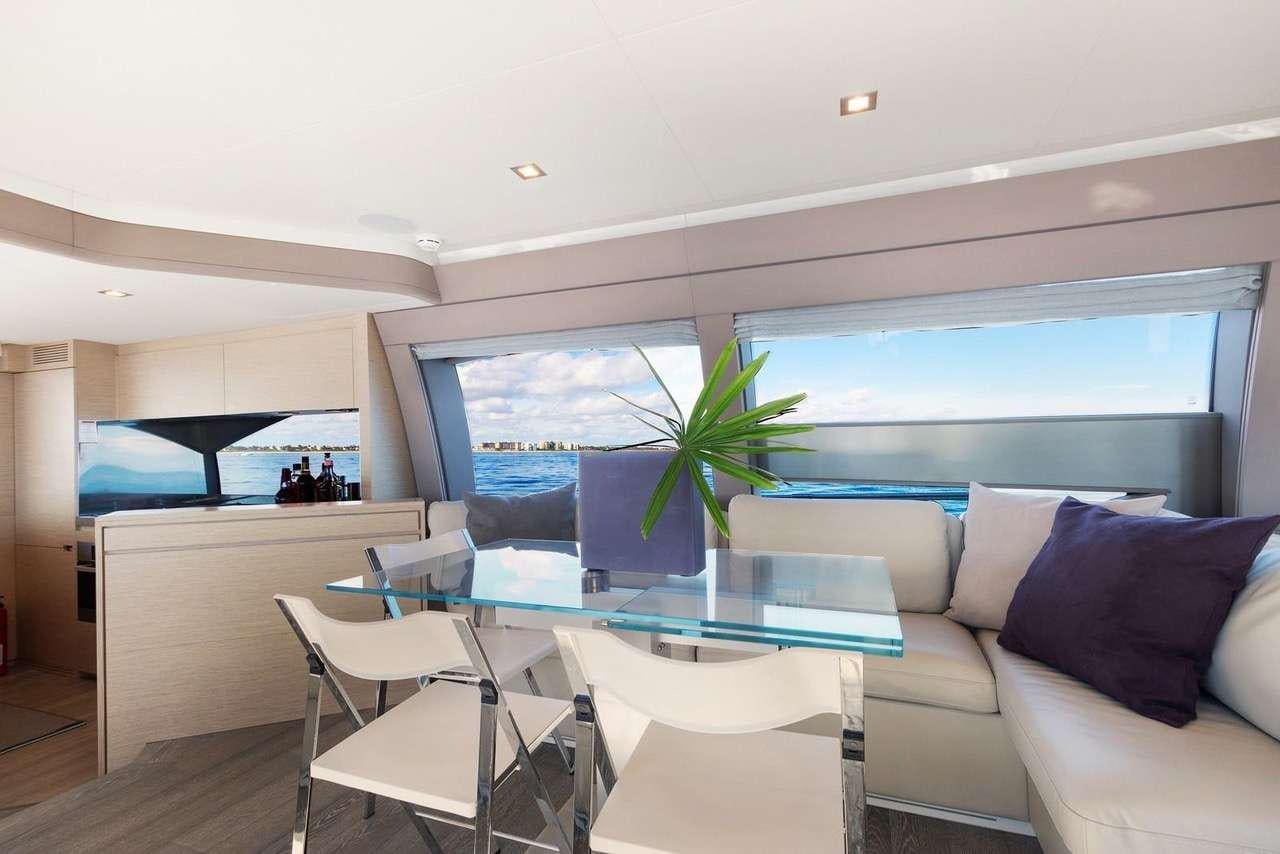 a living room with a large window aboard LINDY LOU Yacht for Charter