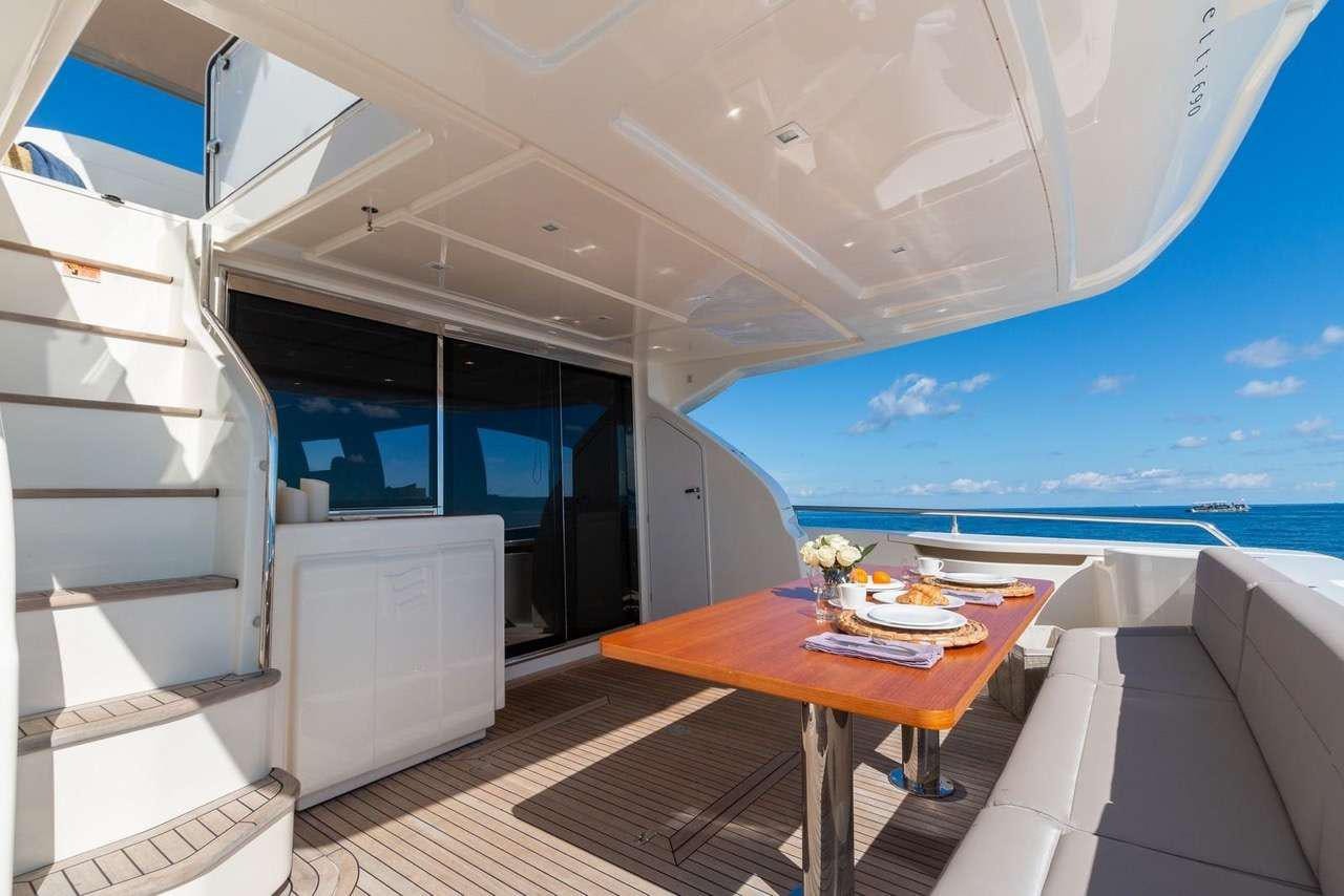 a room with a table and chairs aboard LINDY LOU Yacht for Charter