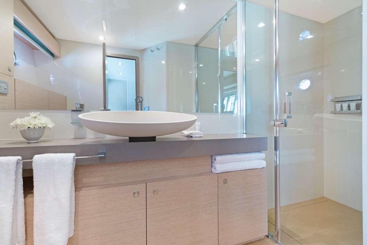 a bathroom with a large mirror aboard LINDY LOU Yacht for Charter