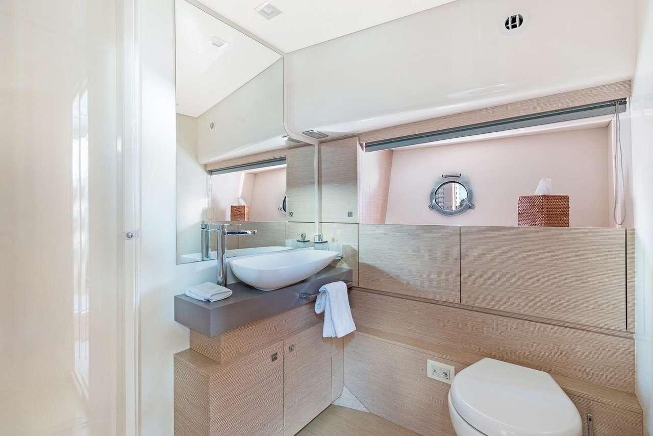 a bathroom with a sink and a toilet aboard LINDY LOU Yacht for Charter