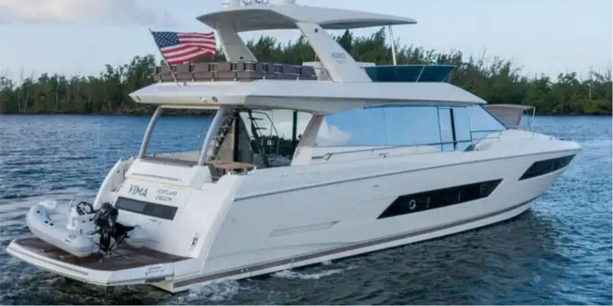 a white boat on the water aboard VIMA Yacht for Charter