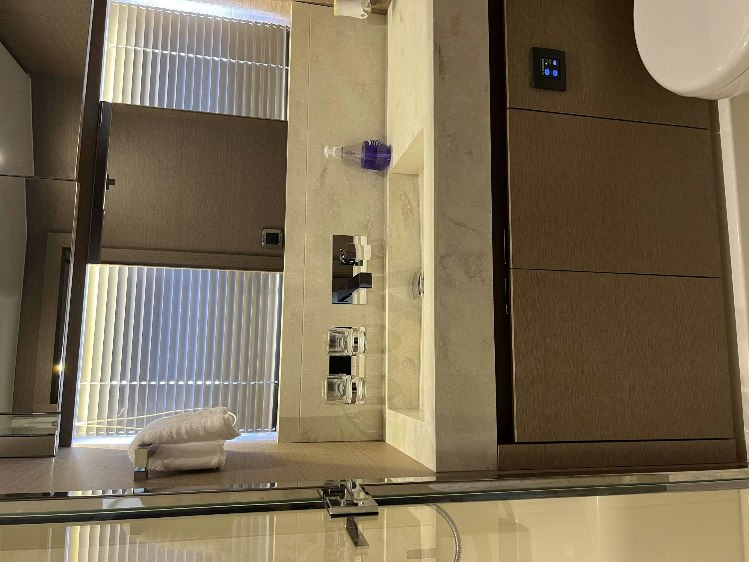 a room with a large window aboard VIMA Yacht for Charter