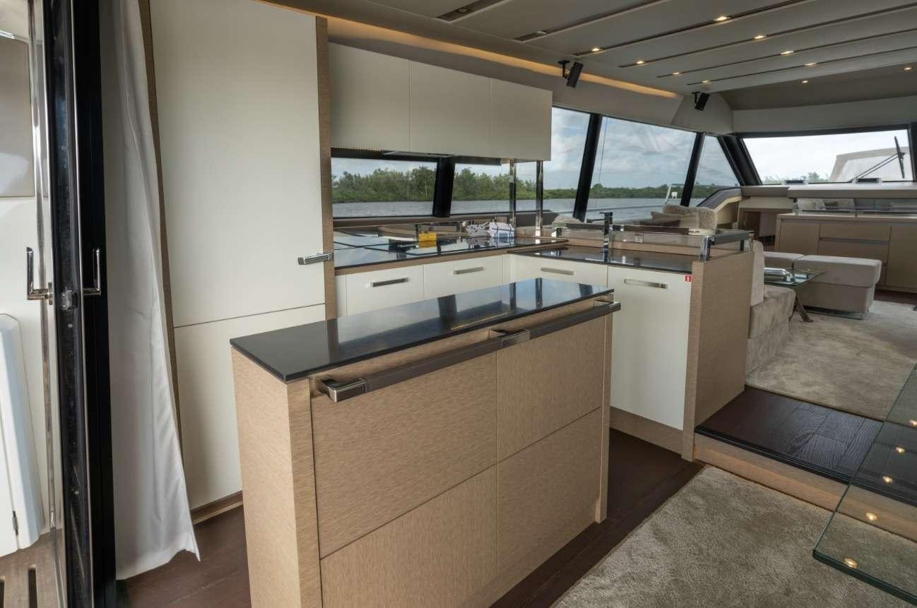 a kitchen with a counter and cabinets aboard VIMA Yacht for Charter