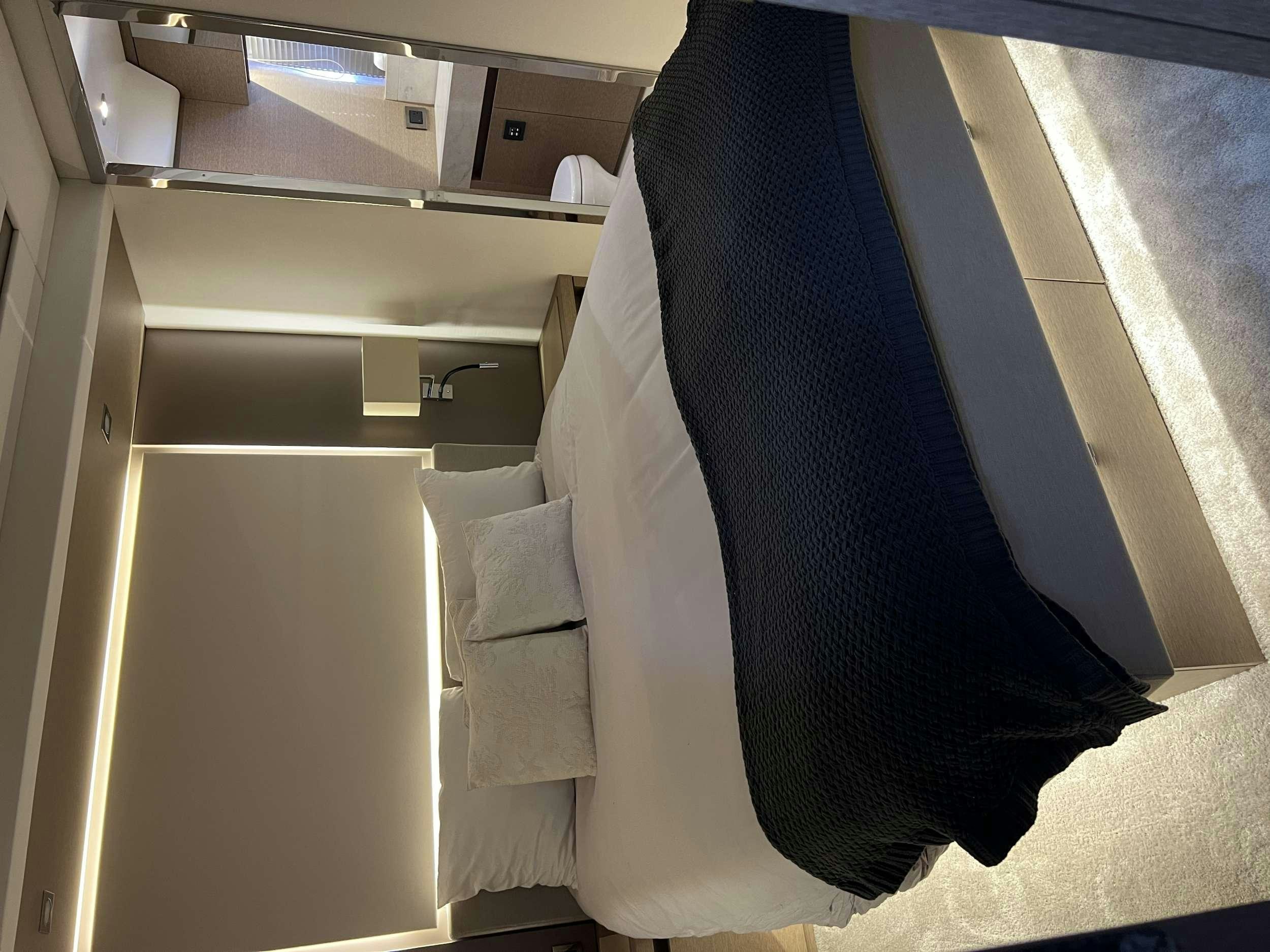 a blue and white towel on a white rack aboard VIMA Yacht for Charter