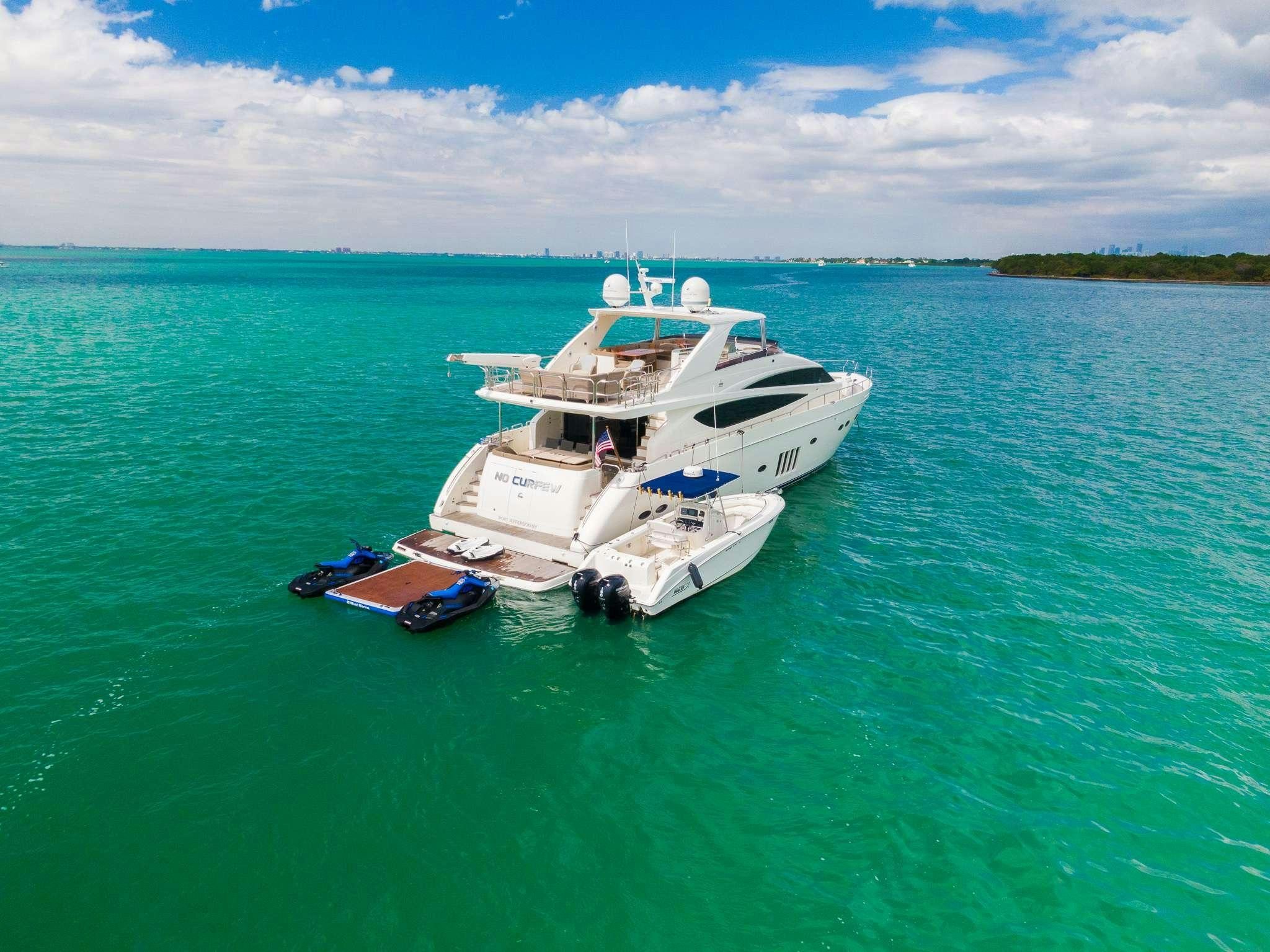 a boat on the water aboard NO CURFEW Yacht for Charter