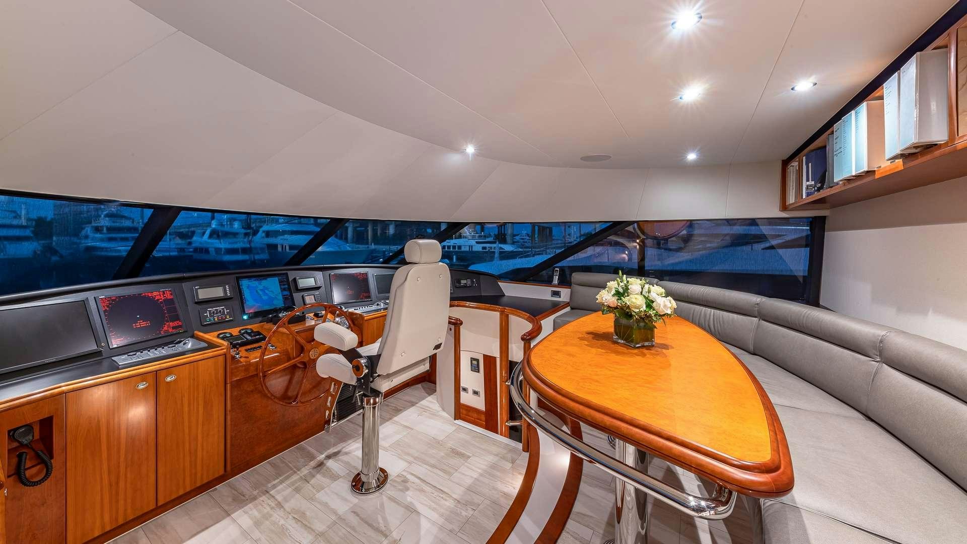 a room with a table and chairs aboard NO SHORTCUTS Yacht for Charter