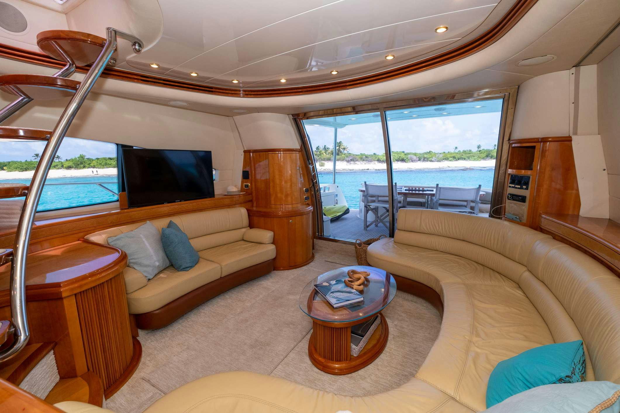a living room with a large window aboard VICTORIA Yacht for Charter
