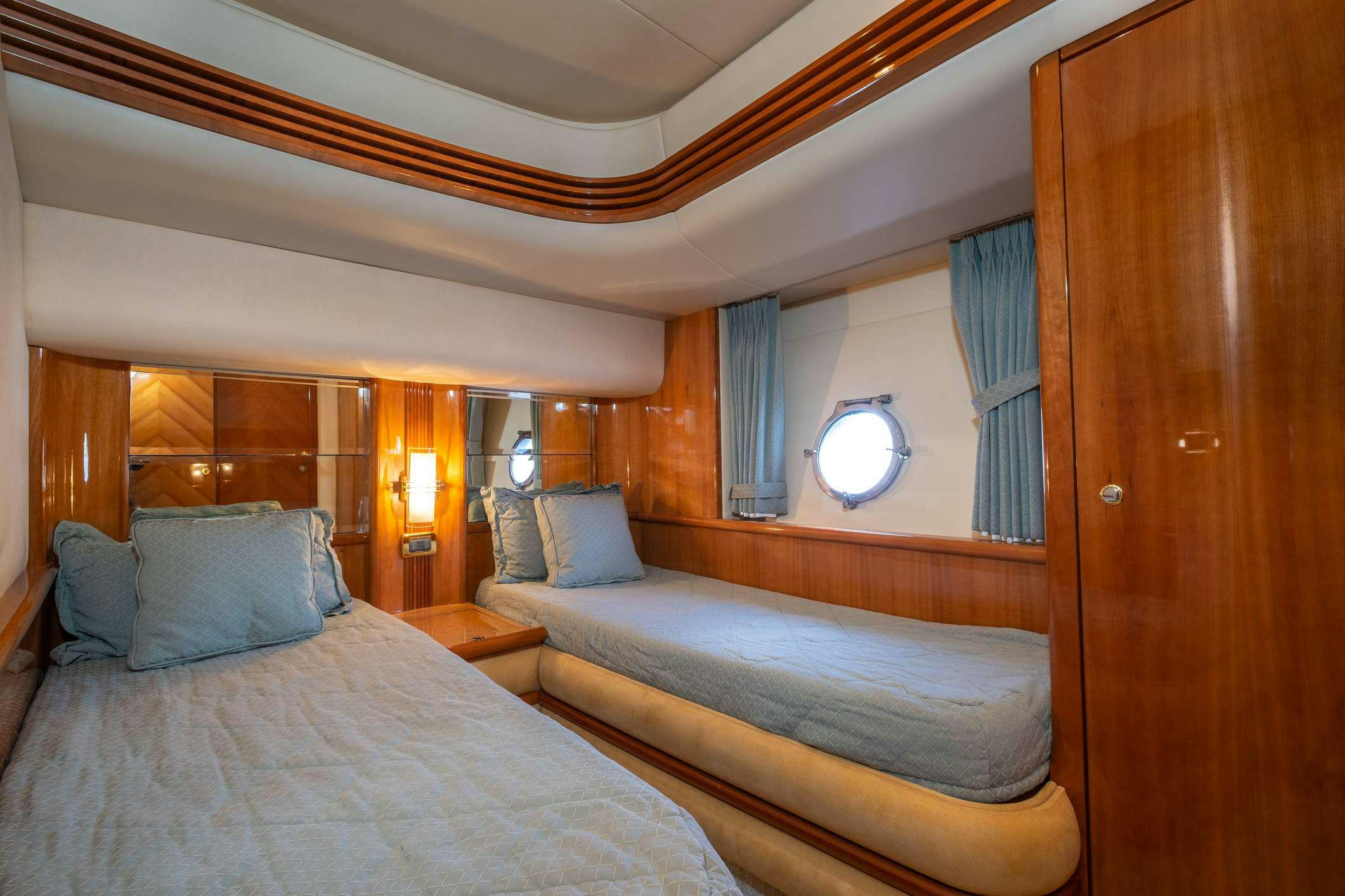 a room with two beds aboard VICTORIA Yacht for Charter