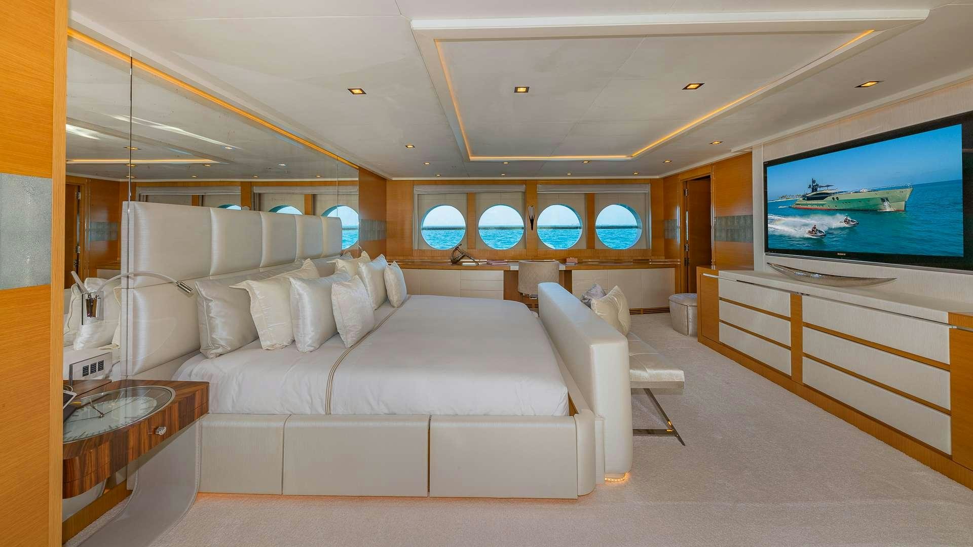 a room with a couch and a television aboard DB9 Yacht for Charter