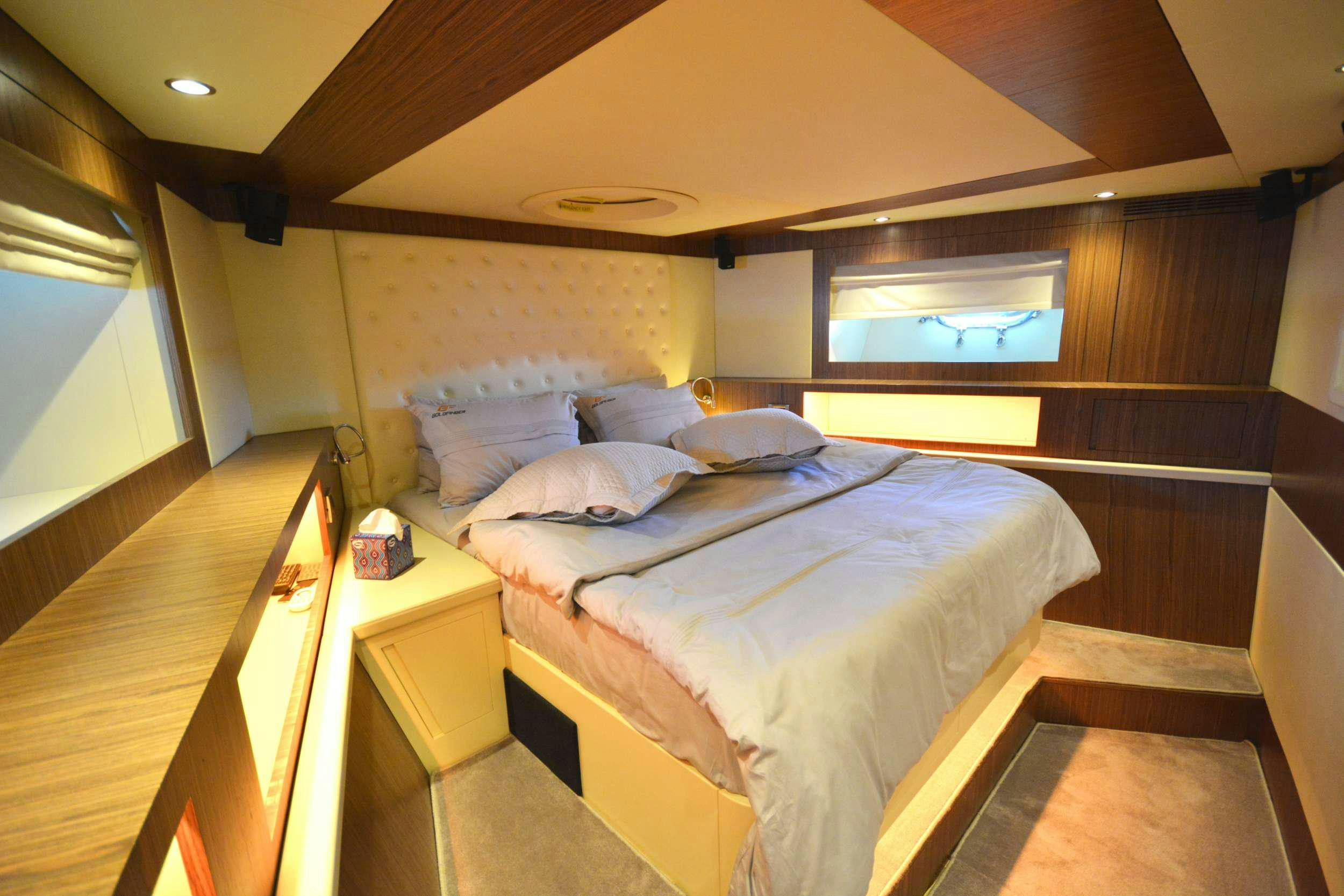 a bed in a room aboard GOLDFINGER Yacht for Charter
