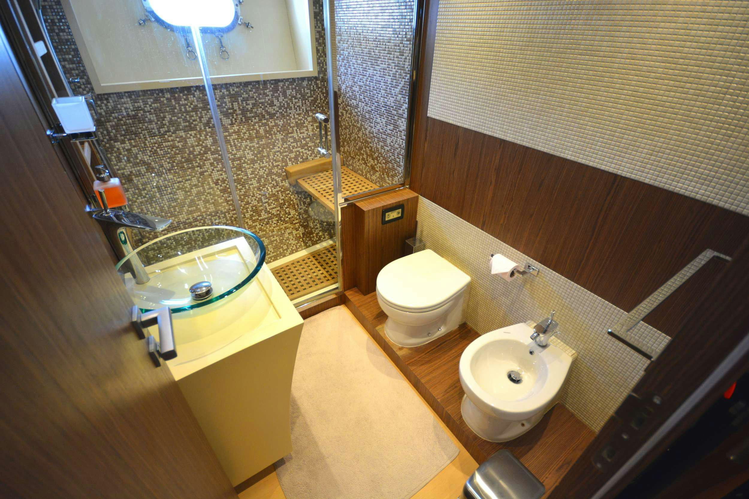 a bathroom with a sink and a toilet aboard GOLDFINGER Yacht for Charter