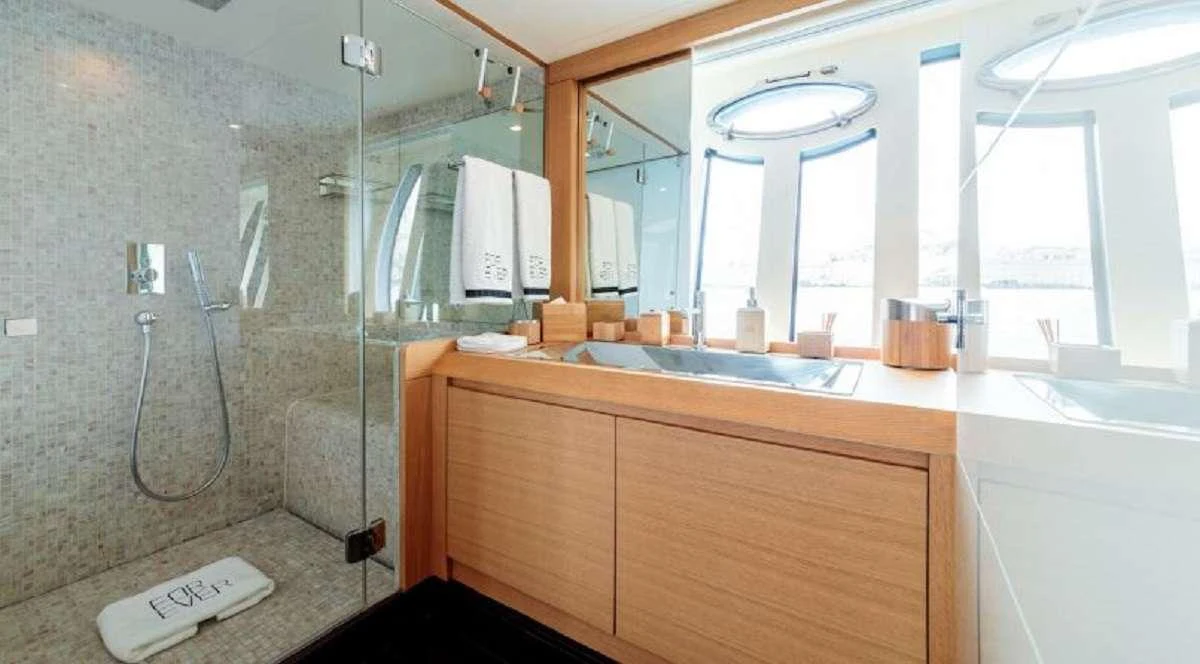 a bathroom with a sink and a shower aboard FOR EVER Yacht for Charter