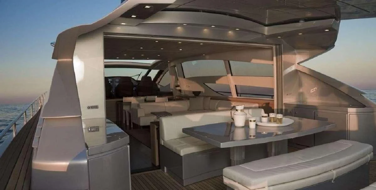 a room with a table and chairs aboard FOR EVER Yacht for Charter