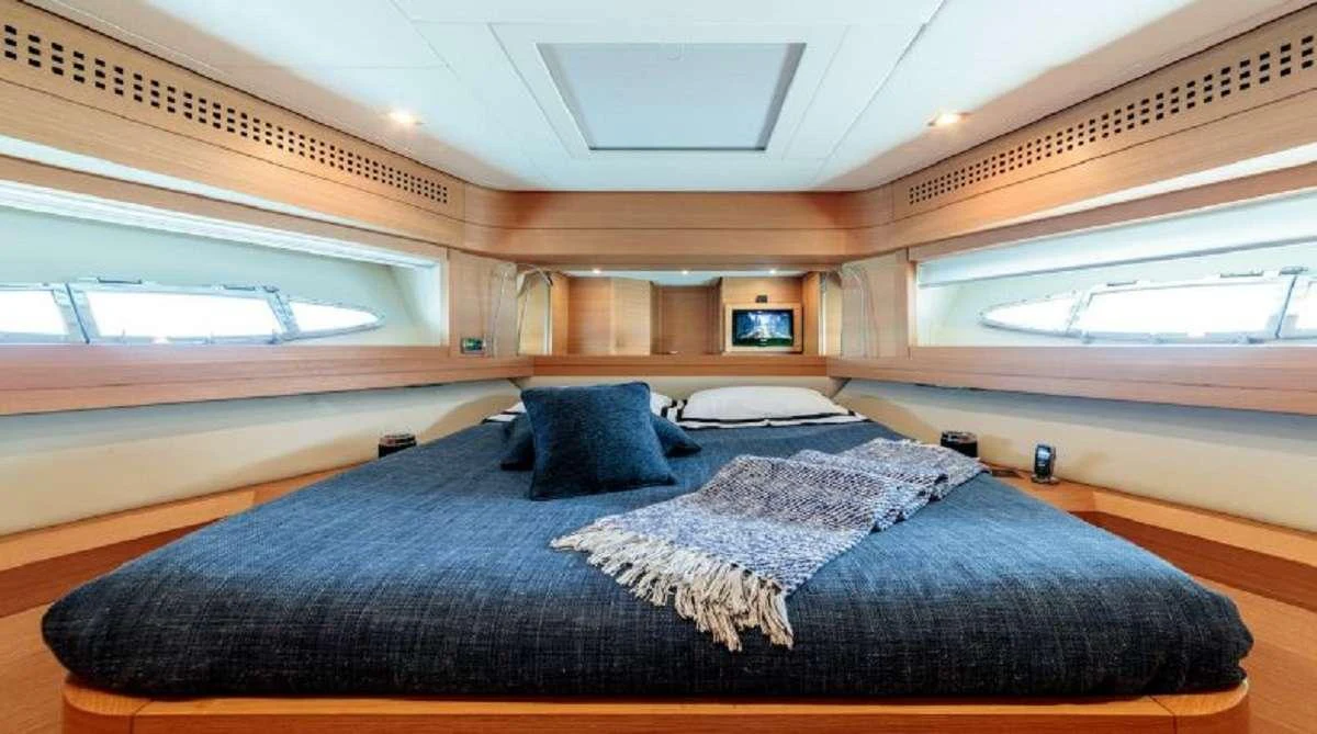 a bed in a room aboard FOR EVER Yacht for Charter