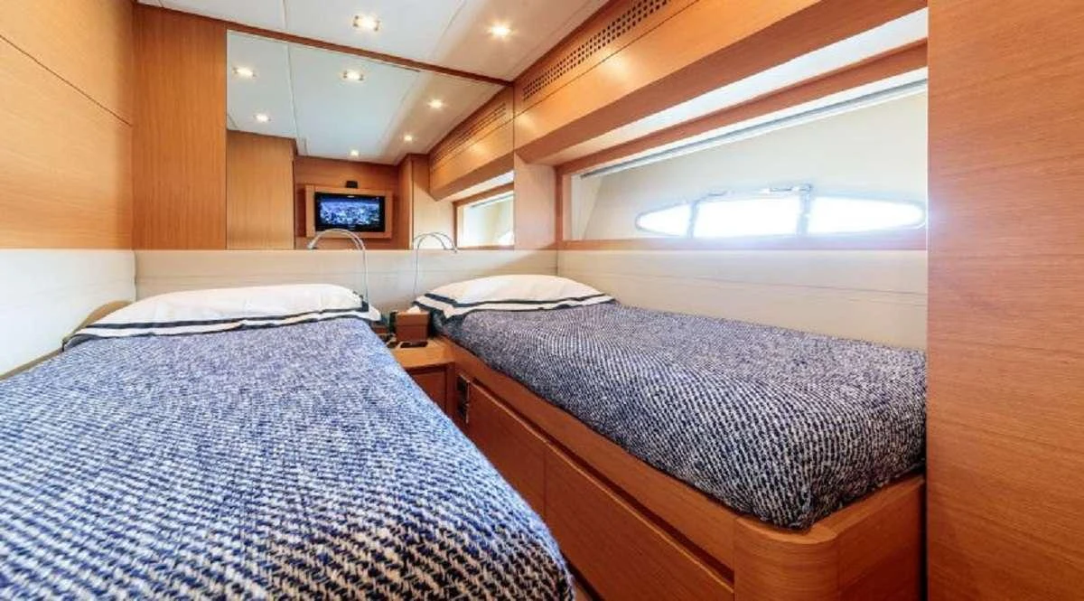 a couple of beds in a room aboard FOR EVER Yacht for Charter