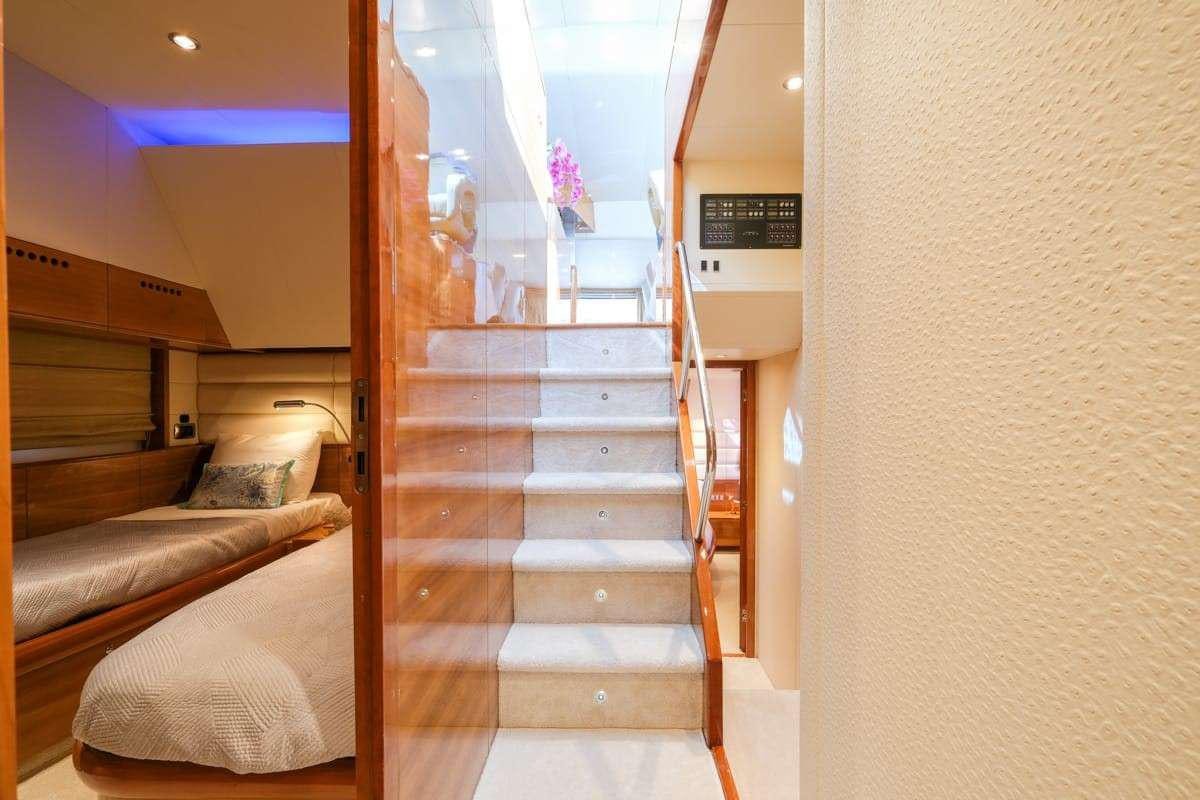 a wooden staircase in a room aboard SUMMER THERAPY Yacht for Charter